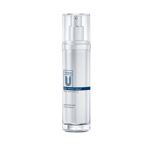 Skincare serum bottle with a clear label on a white background