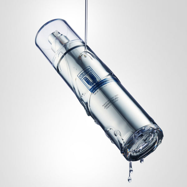 cu vitamin u toner Skincare serum bottle with dropper on a light gray background.