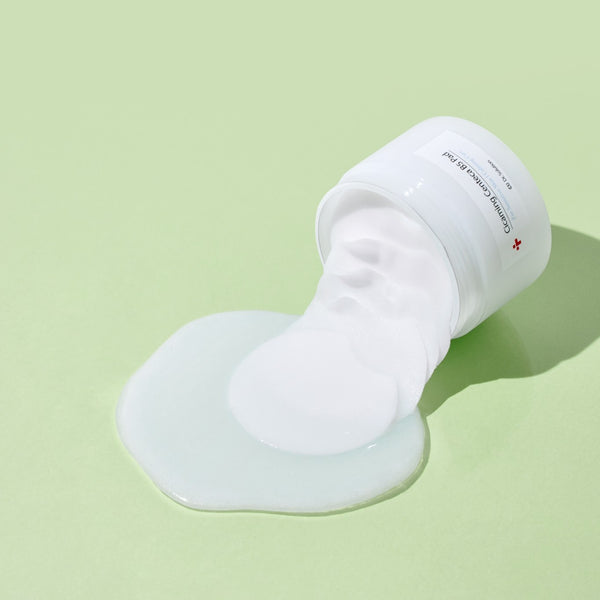 dr solution cicaming centeca b5 toner pad white container of cream on a light green background.