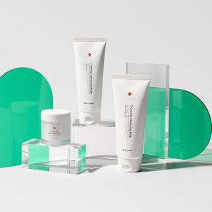 front view of three dr solution cicaming cleansing milk products on glass shelves.