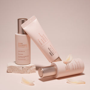 Three skincare products on a beige background dr solution pdrn bakuchiol cream 100 moisturizer and ampoule 100 set.